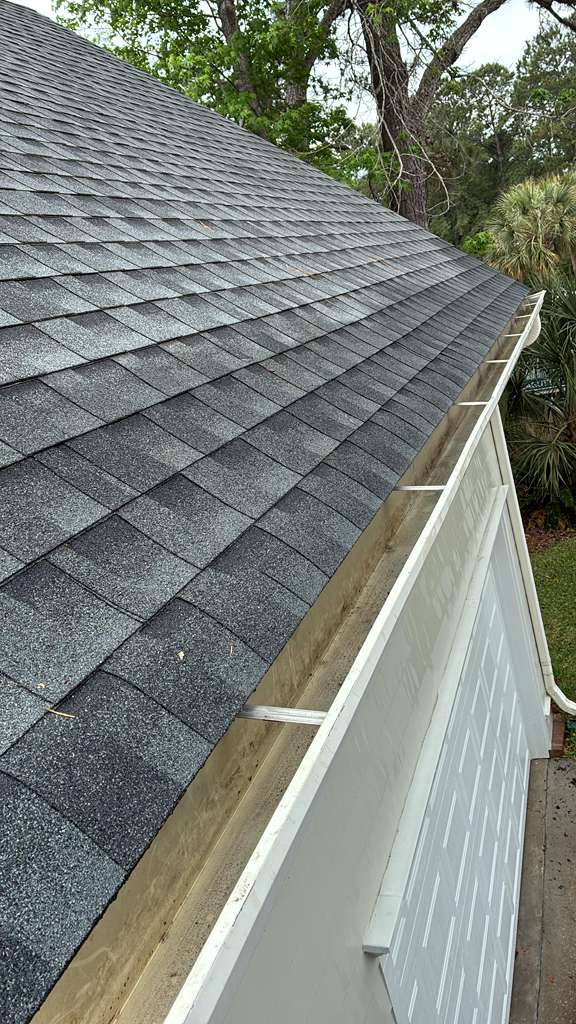 Gutter professionally cleaned with clear water flow
